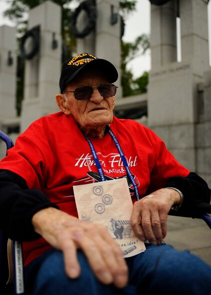 Paul Merriman, a World War II Army veteran, visits the National World War II Memorial in Washington, D.C., April 30, 2016, as part of Syracuse Honor Flight. Merriman holds a copy of the leaflets the Germans left him and his brothers-in-arms while they were a sleep. (U.S. Air Force photo/Tech. Sgt. Bryan Franks)