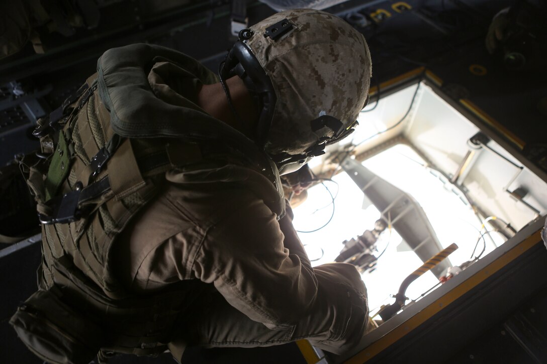 Cpl. Aaron Culler, a crew chief with Marine Medium Tiltrotor Squadron (VMM) 165, observes the Bambi bucket from an MV-22B Osprey and waits to release the water over a designated drop zone during the 2016 Wildland Firefighting Exercise aboard Marine Corps Base Camp Pendleton, Calif., May 5. The exercise was a multiaircraft operation with both ground and air units working together for maximum firefighting efforts. (U.S. Marine Corps photo by Lance Cpl. Harley Robinson/Released)