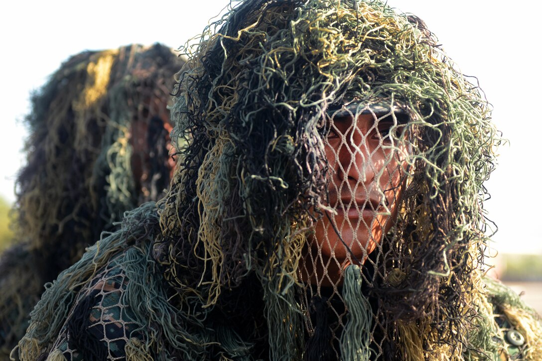 Special operations service members wear ghillie suits during the opening ceremony of Fuerzas Comando 2016 in Ancon, Peru, May 2, 2016. Army photo by Sgt. Eric Roberts