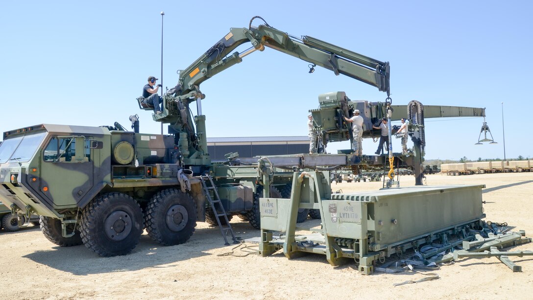 88th Regional Support Command Equipment Concentration Site - 67 personnel train Soldiers from the 1015th Quartermaster Company, 451st Quartermaster Company and the 818th Engineer Battalion on Dry Span Support Bridge operation and maintenance at the soon to be established Draw Yard at ECS-67 on Fort McCoy, Wis., May 5.