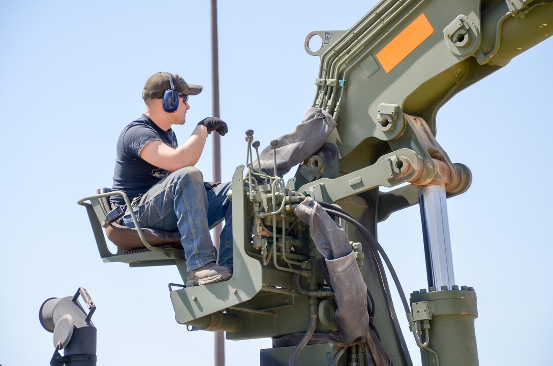 88th Regional Support Command Equipment Concentration Site - 67 personnel, Heath Thornsen operates a Dry Support Bridge, a new-generation tactical military bridging system, at the soon to be established Draw Yard at ECS-67 on Fort McCoy, Wis., May 5.