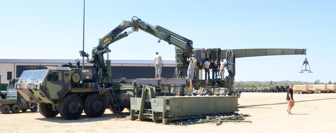 88th Regional Support Command Equipment Concentration Site - 67 personnel train Soldiers from the 1015th Quartermaster Company, 451st Quartermaster Company and the 818th Engineer Battalion on Dry Span Support Bridge operation and maintenance at the soon to be established Draw Yard at ECS-67 on Fort McCoy, Wis., May 5.