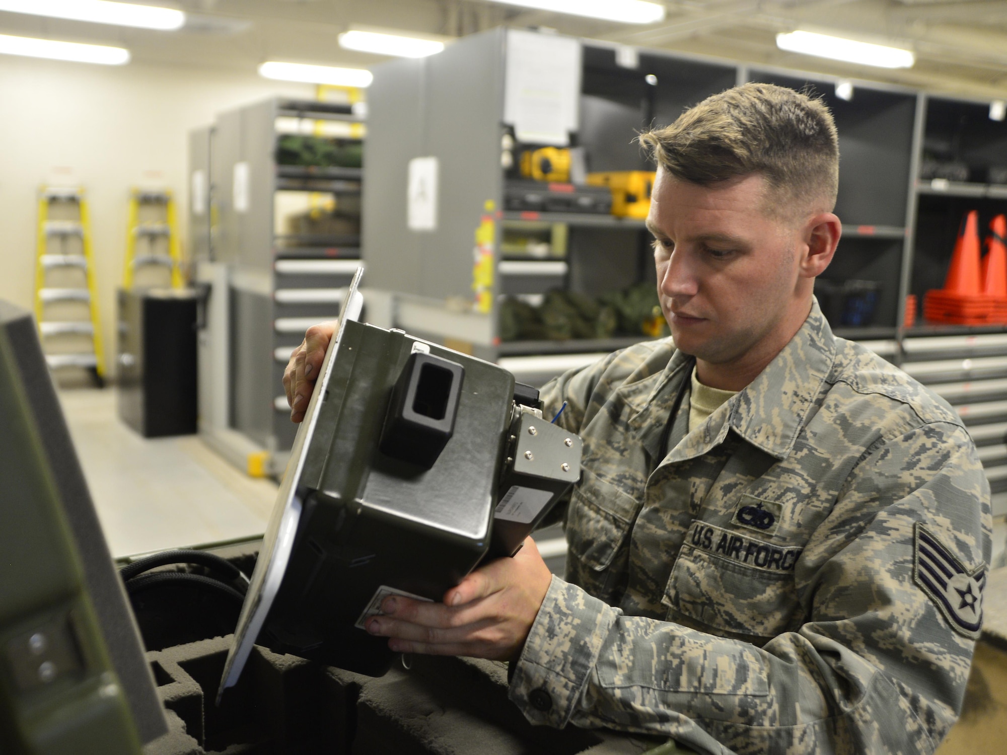 Staff Sgt. Ronald, 432nd Maintenance Group quality assurance inspector, inspects an identification friend or foe transponder May 3, 2016. QA inspects the support shops to ensure Airmen have the right tools for maintenance and aircraft parts are serviceable. (U.S. Air Force photo by Senior Airman Christian Clausen/Released)