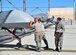 Tech. Sgt. Remington, a 432nd Maintenance Group quality assurance inspector, watches as a 432nd Aircraft Maintenance Squadron Tiger Aircraft Maintenance Unit team checks the weight and balance of an MQ-1 Predator on May 3, 2016, at Creech Air Force Base, Nev. QA plays an essential role in completing the maintenance mission by ensuring maintainers follow technical orders and correctly complete maintenance. Missing minor mistakes or making maintenance errors can result in serious damage to aircraft and personnel. (U.S. Air Force photo/Senior Airman Christian Clausen)