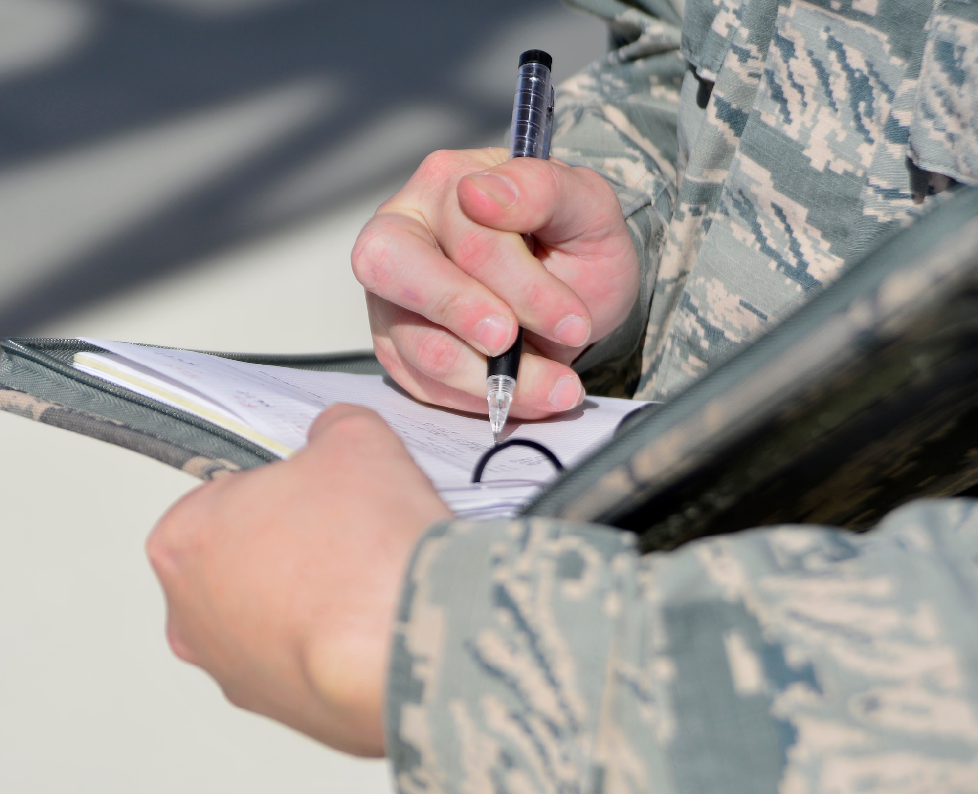 Tech. Sgt. Remington, 432nd Maintenance Group quality assurance inspector, takes notes as a 432nd Aircraft Maintenance Squadron Tiger Aircraft Maintenance Unit team checks the weight and balance of an MQ-1 Predator May 3, 2016. QA personnel are accountable for being knowledgeable and well-trained, enforcing the standards, and inspecting all the work performed on the MQ-1 Predator and MQ-9 Reaper within the 432nd Maintenance Group. (U.S. Air Force photo by Senior Airman Christian Clausen/Released)