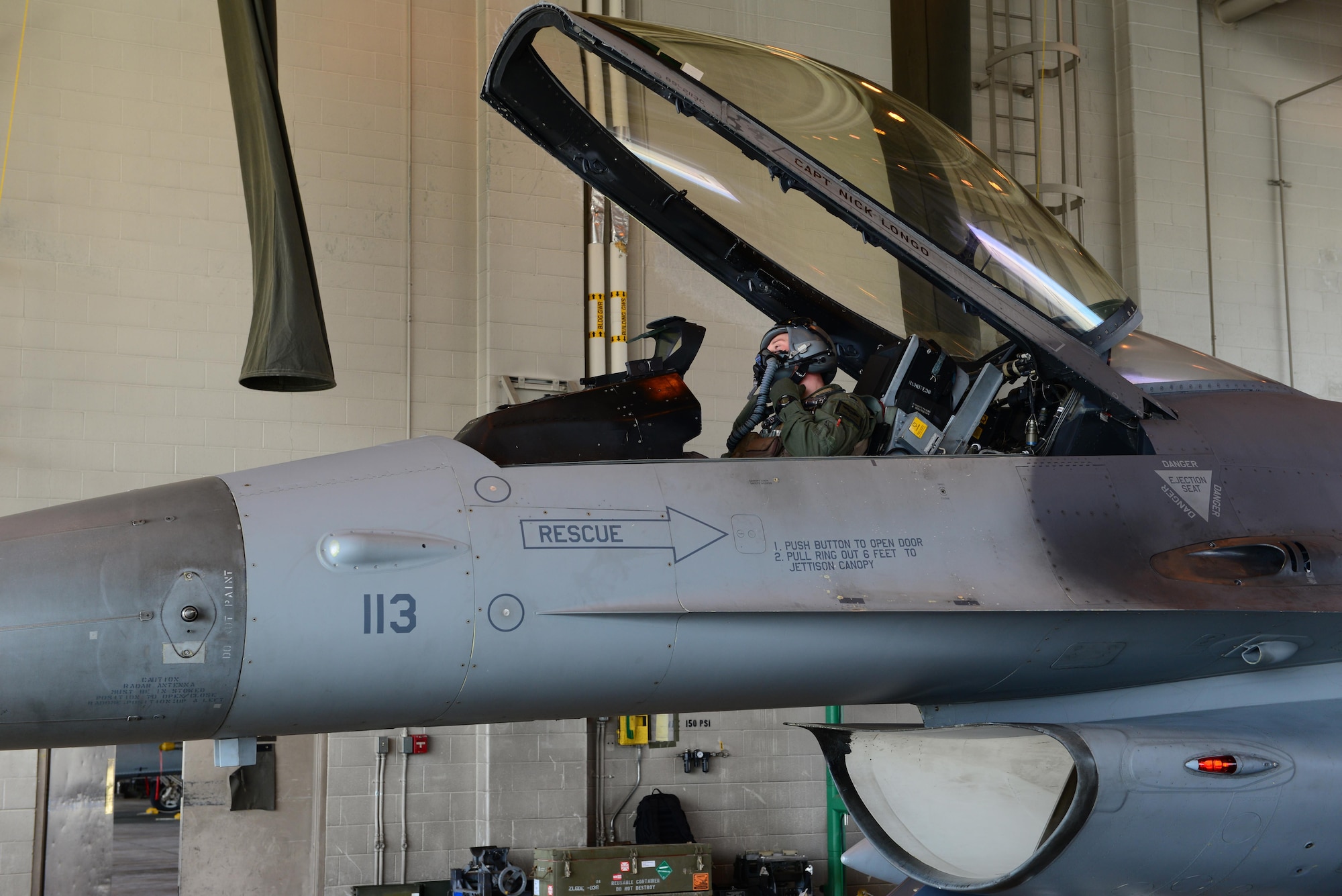 U.S. Air Force 1st Lt. Jacob “Hobs” Houder, a pilot assigned to the 80th Fighter Squadron, Kunsan Air Base, Republic of Korea, tests his helmet May 5, 2016, at Eielson Air Force Base, Alaska. Houder is participating in his first RED FLAG-Alaska exercise, which provides combined offensive counter-air, interdiction, close air support and large force-employment training in a simulated combat environment. (U.S. Air Force photo by Airman 1st Class Cassandra Whitman/Released)