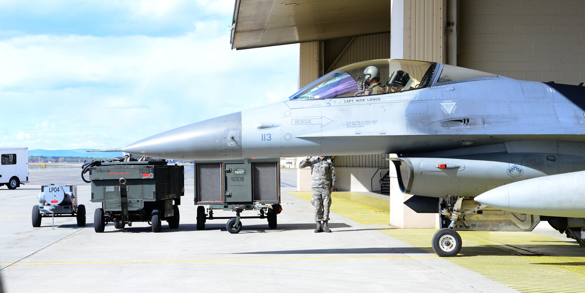 U.S. Air Force 1st Lt. Jacob “Hobs” Houder, a pilot assigned to the 80th Fighter Squadron, Kunsan Air Base, Republic of Korea, tests his helmet May 5, 2016, at Eielson Air Force Base, Alaska. Houder is participating in his first RED FLAG-Alaska exercise, which provides combined offensive counter-air, interdiction, close air support and large force-employment training in a simulated combat environment. (U.S. Air Force photo by Airman 1st Class Cassandra Whitman/Released)