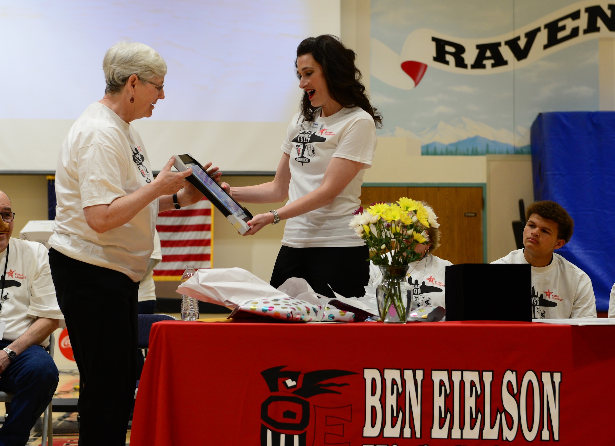 Nancy Woodward, the Ben Eielson High School librarian, presents Britten Follett of Follett with a gift May 6, 2016, at Eielson Air Force Base, Alaska. BEHS won the 5th Annual Follett Challenge grand prize of $60,000 for its innovative STEM program. (U.S Air Force photo by Airman 1st Class Cassandra Whitman/Released) 