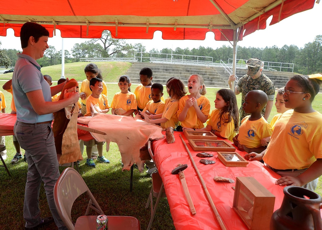 Julie Robbins, natural and cultural resources manager, Installation and Environment Division, Marine Corps Logistics Base Albany, shares information with International Studies Elementary School, Albany, Ga., during the annual Unity Day celebration held recently on the base. 