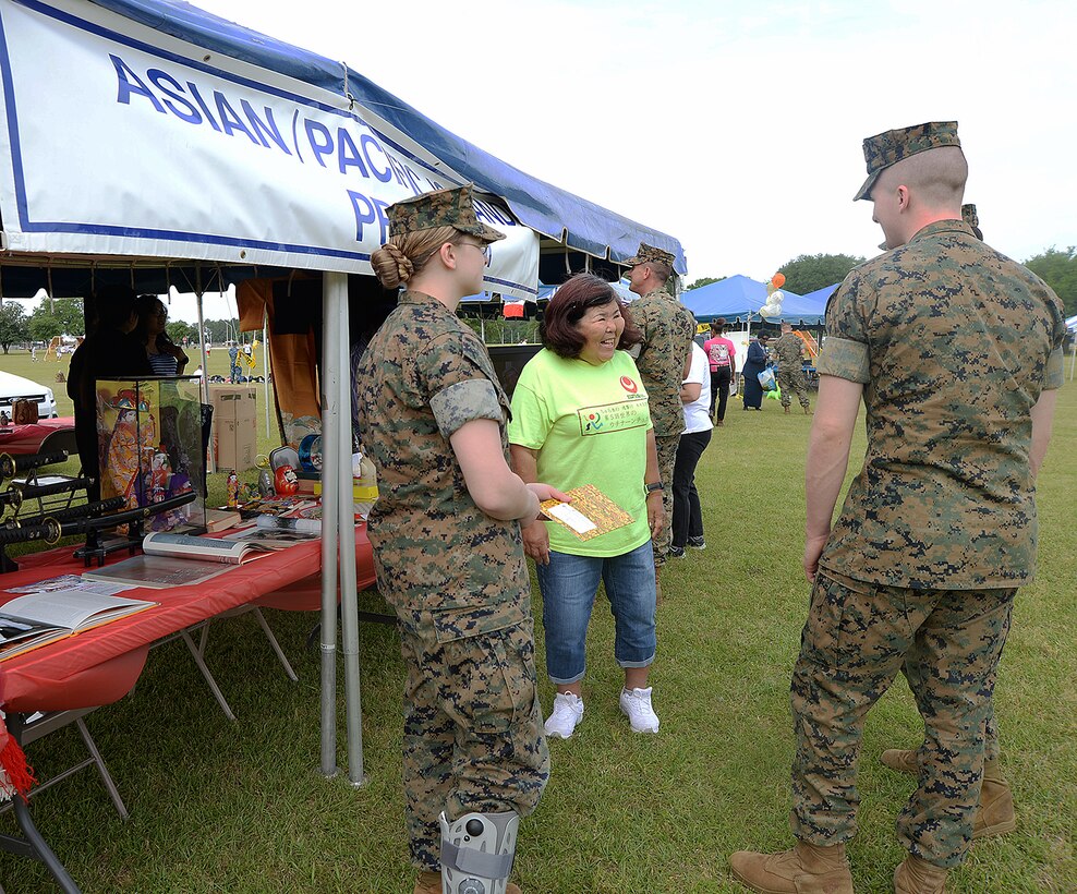 Marines visit the Asian/Pacific tent during the annual Unity Day celebration recently on the installation. The event is held to educate individuals on diversity and celebrate differences.