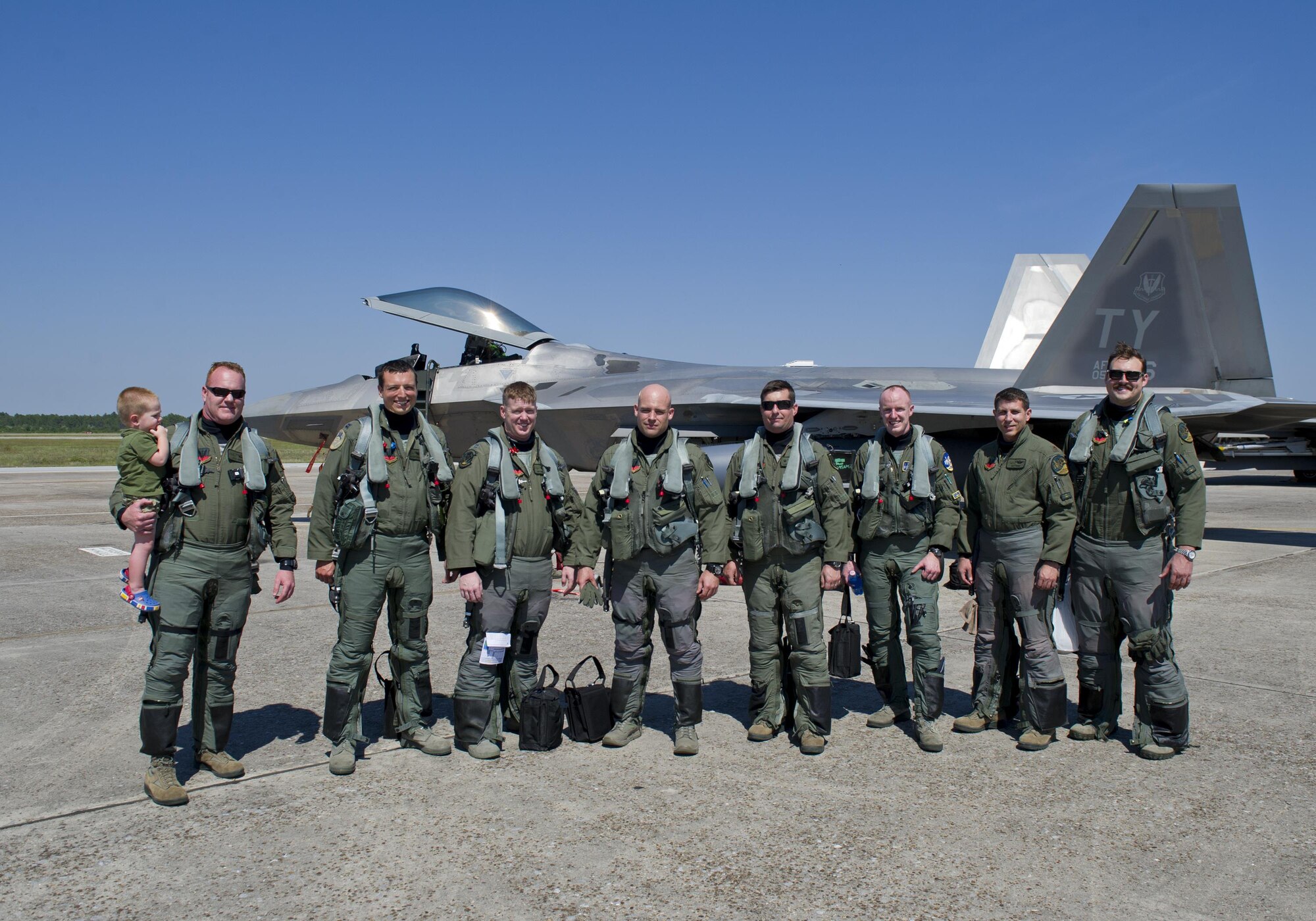 Pilots from the 95th Fighter Squadron pose for a photo after returning from a deployment to Europe May 8, 2016, on the Tyndall flightline. This marks the second time the 95th FS has deployed to U.S. European Command’s Area of Responsibility to train with NATO allies. (U.S. Air Force photo by Senior Airman Alex Fox Echols III/Released)