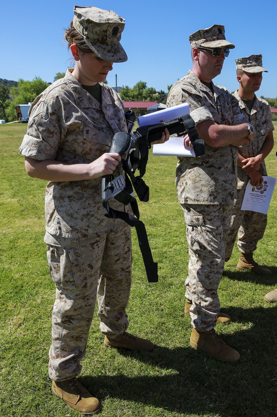 MARINE CORPS BASE CAMP PENDLETON, Calif. – U.S. Navy Lt. Kathryn Weiss, a staff nurse in the emergency department at Naval Hospital Camp Pendleton, examines a prototype being presented at the Expeditionary Energy Concepts symposium at Camp Pendleton May 3, 2016. The knee brace is designed to harvest kinetic energy as Marines walk and power radios, batteries and other equipment. E2C features new technologies developed by outside companies to improve the reach and effectiveness of the Marine Corps. The three-day event also gives Marines who would work with the technology on a daily basis the opportunity to identify possible areas for improvement. (U.S. Marine Corps photo by Lance Cpl. Caitlin Bevel)