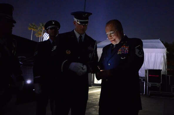 Master Sgt. Israel Del Toro shows the Patrick Air Force Base Honor Guard a photo he took of them during the opening ceremony of Invictus Games 2016 in Orlando, Fla., May 8, 2016. The Invictus Games are composed of 15 nations with over 500 military competitors competing in 10 sporting events May 8-12, 2016. (U.S. Air Force Photo/Tech. Sgt. Joshua L. DeMotts)