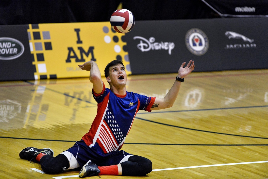 Army veteran Nicholas Titman serves the ball in a preliminary sitting volleyball game against the Canadian team at the 2016 Invictus Games in Orlando, Fla., May 7, 2016. Air Force photo by Tech. Sgt. Joshua DeMotts