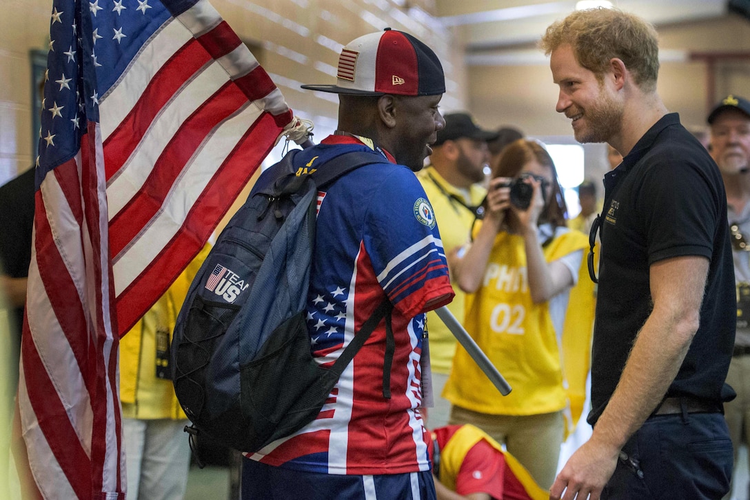 Prince Harry, right, and Army Sgt. 1st Class Michael Smith, a U.S. team member, thank each other for their respective service and talk about global efforts to increase awareness and support for wounded warriors during the 2016 Invictus Games in Orlando, Fla., May 7, 2016. Air Force photo by Senior Master Sgt. Kevin Wallace
