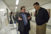 John Grimes, a naval architect with the Center for Innovation in Ship Design (Code 8202), presents the Indicative Ship Design project to Capt. Mark Vandroff, prospective commanding officer of Naval Surface Warfare Center, Carderock Division, during the Naval
Innovative Science and Engineering/Section 219 Expo at the Pentagon April 21. (U.S. Navy photo by Monica McCoy/Released)