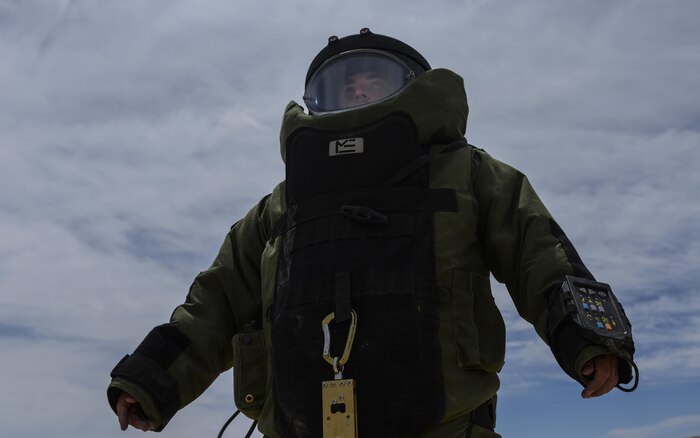 Staff Sgt. Jeffery Glover, 99th Civil Engineer Squadron explosive ordinance technician, looks back at his team during a training exercise at Nellis Air Force Base, Nev., May 5, 2016. EOD techs are trained to detect, disarm, detonate and dispose of explosive threats all over the world. (U.S. Air Force photo by Airman 1st Class Kevin Tanenbaum)