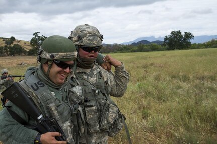 U.S. Army Spc. Franklin Gardner (right), 238th Transportation Company (TC) from Concord, Calif. is buddy carried by Pvt. Dante McCray, 238th TC on Fort Hunter Liggett, Calif. on May 7, 2016. McCray moves Gardner out of the line of fire as his unit is engaged in pulling a 360 degree security. The 238th TC conducts a training to establish a Tactical Assembly Area during the WAREX hosted by 91st Training Division. (U.S. Army photo by Spc. Sean McCallon, 91st Training Division public affairs.)