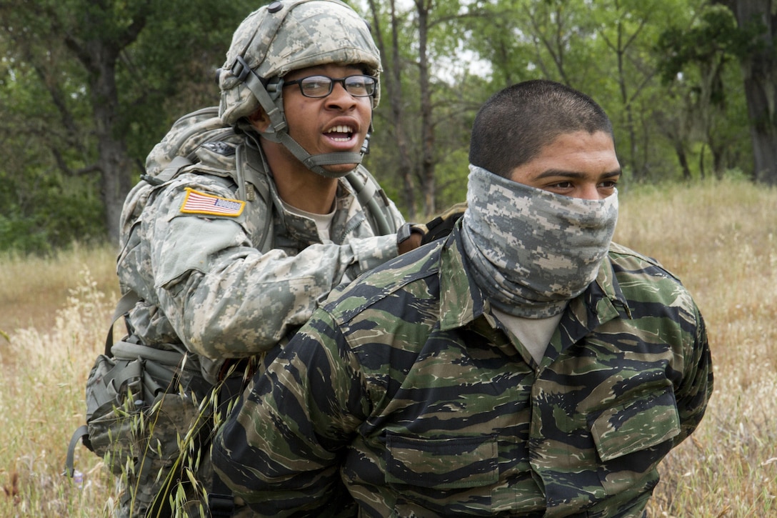 U.S. Army Pfc. David Mitchell, 238th Transportation Company (TC) from Concord, Calif. detains Spc. Dameon Sanchez, 422 Military Police Company from Bakersfield, Calif. during a training exercise on Fort Hunter Liggett, Calif. on May 7, 2016. Mitchell captured Sanchez, who operated as the opposing force, during an exercise that the 238th TC conducted to establish a Tactical Assembly Area. (U.S. Army photo by Spc. Sean McCallon, 91st Training Divsion public affairs.)