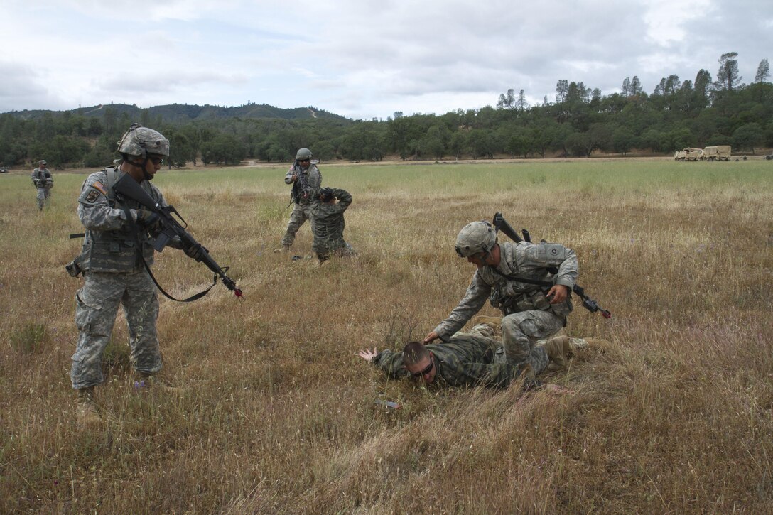 U.S. Army Soldiers from the 238th Transportation Company (TC) from Concord, Calif. detain opposing forces on Fort Hunter Liggett, Calif. on May 7, 2016. The 238th recieved training in establishing a Tactical Assembly Area during the WAREX event hosted by 91st Training division, when they were attacked by opposing forces, whom they were able to detain. (U.S. Army photo by Spc. Sean McCallon, 91st Training Division public affairs.)