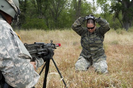 U.S. Army Spc. Kristina Medlock, 422nd Military Police Company from Bakersfield, Calif. is being detained while acting as opposing forces for the 238th Transportation Company's (TC) exercise on Fort Hunter Liggett, Calif. on May 7, 2016. Medlock was assigned to ambush the 238th TC while they attempted to establish a Tactical Assembly Area during the WAREX event hosted by 91st Training division. (U.S. Army photo by Spc. Sean McCallon, 91st Training Division public affairs.)