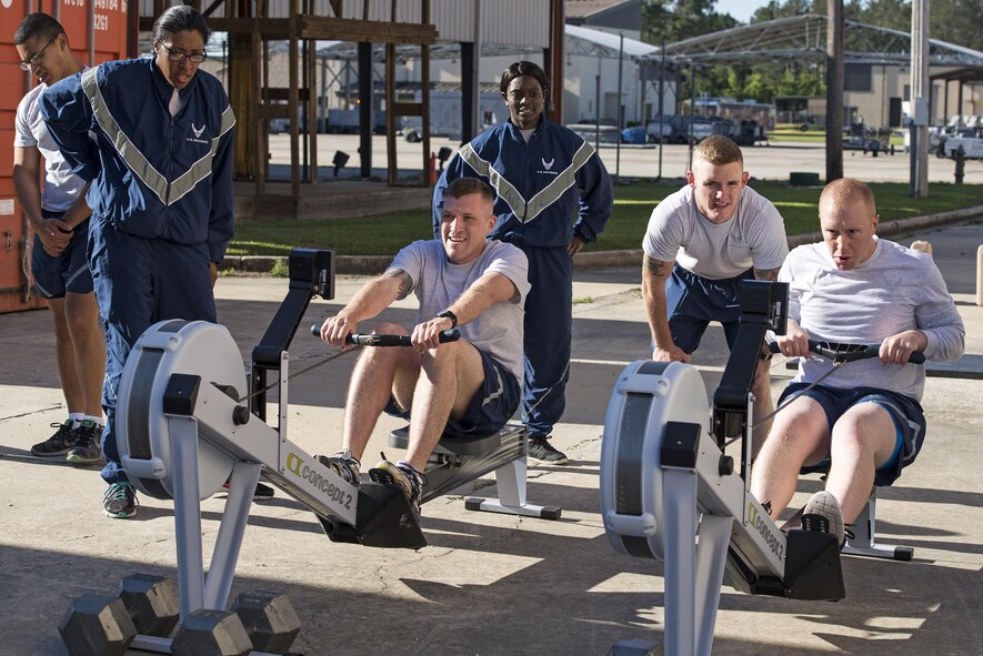 U.S. Air Force Airmen participate in a rowing race during an upper body strength challenge, May 6, 2016, at Moody Air Force Base, Ga. Participants had to row 500 meters, carry two 50 pound water jugs for 100 meters, drag an 185 pound dummy 100 meters, and finish the challenge with 25 pull ups. (U.S. Air Force photo by Airman 1st Class Janiqua P. Robinson/Released)