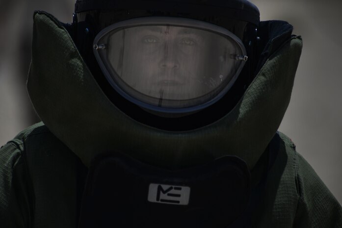 Staff Sgt. Jeffery Glover, 99th Civil Engineer Squadron explosive ordinance technician, walks back to his team after securing a line that will open a car door during a training exercise at Nellis Air Force Base, Nev., May 5, 2016. EOD techs detect, identify, recover, disarm and dispose of unsafe explosives and ordnance. (U.S. Air Force photo by Airman 1st Class Kevin Tanenbaum)