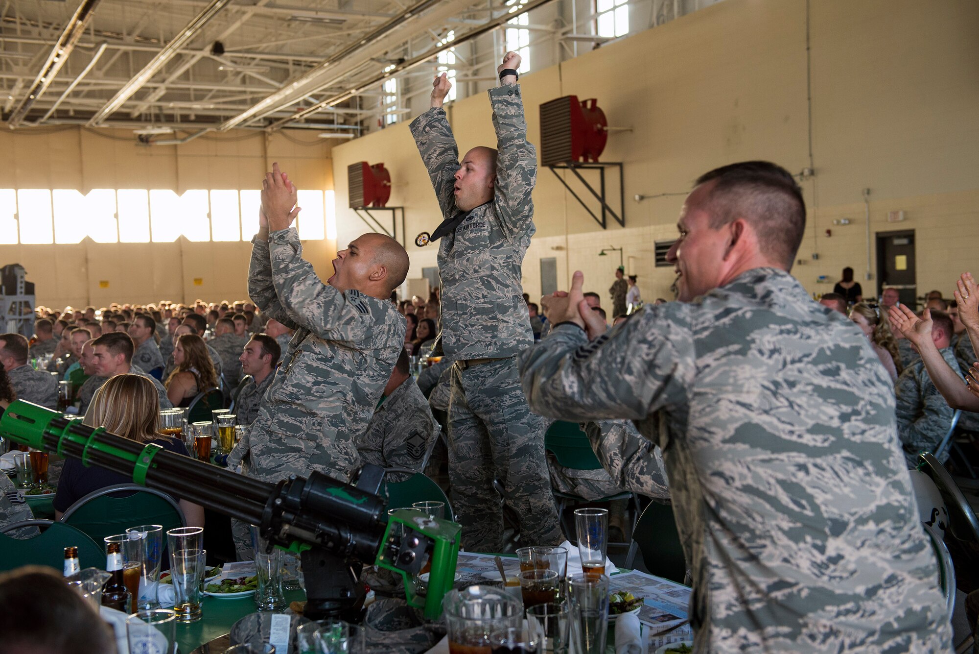 U.S. Air Force Airmen from the 823d Maintenance Squadron, Nellis Air Force Base, Nev., celebrate during the 2016 Maintenance Professional of the Year awards banquet, May 6, 2016, at Moody Air Force Base, Ga. The 823d MXS reports to the 563d Rescue Group located at Davis-Monthan AFB, Ariz., that is assigned to the 23d Wing, here. (U.S. Air Force photo by Airman 1st Class Greg Nash/Released) 