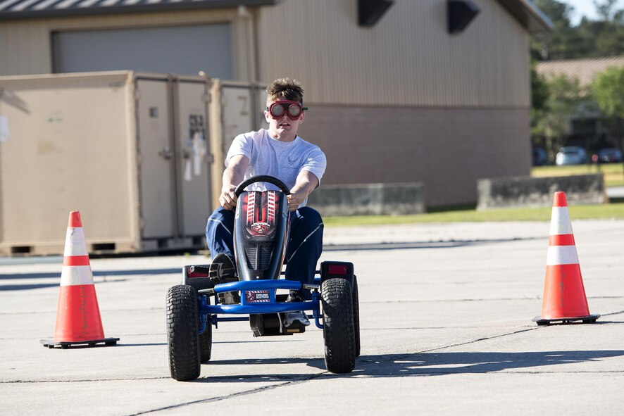U.S. Air Force Airman 1st Class James Meeks, 23d Equipment Maintenance Squadron aerospace ground equipment apprentice, operates a go-kart during Super Sports day, May 6, 2016, at Moody Air Force Base, Ga. To make the course challenging, participants wore goggles simulating the affect alcohol can have on vision. (U.S. Air Force photo by Airman 1st Class Janiqua P. Robinson/Released)