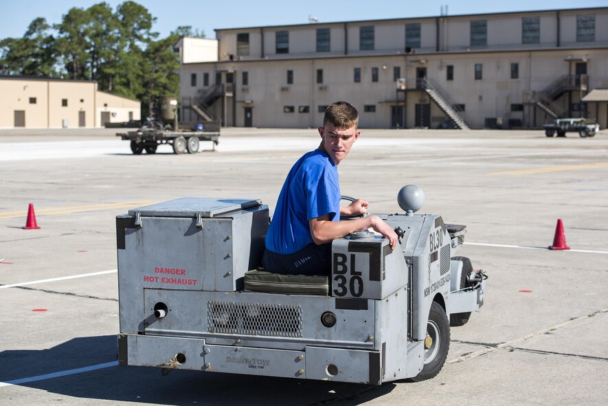 U.S. Air Force Airman 1st Class Tyler Henson, 723d Aircraft Maintenance Squadron weapons technician, operates a jammer, May 6, 2016, at Moody Air Force Base, Ga. Participants were timed while driving the jammer through the course forward and backward and had two seconds added to their time for every cone they hit. (U.S. Air Force photo by Airman 1st Class Janiqua P. Robinson/Released)