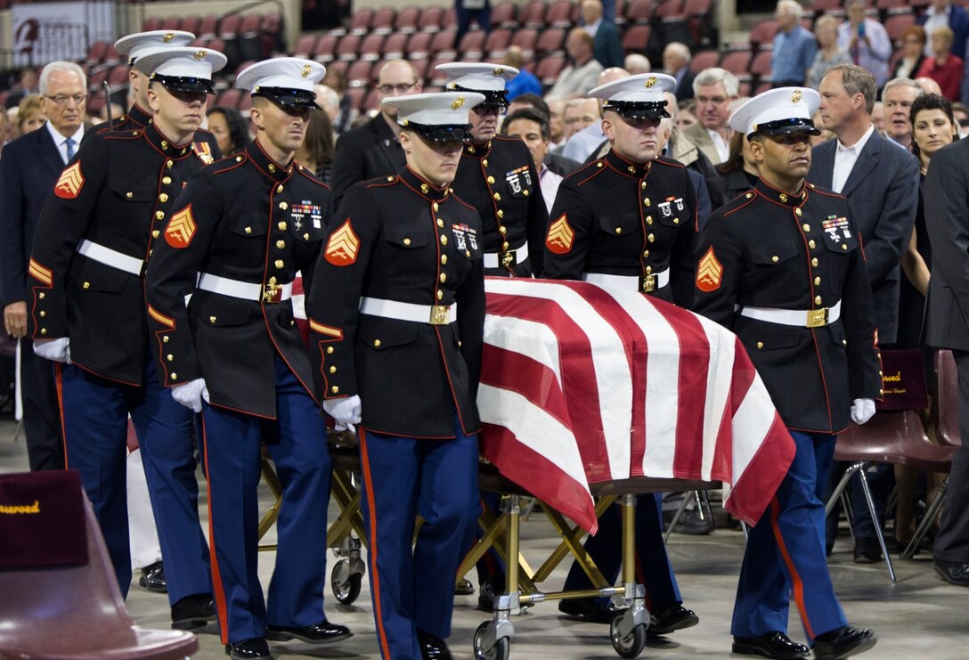 Marines with 4th Law Enforcement Battalion, Force Headquarters Group, Marine Forces Reserve, escort the casket of Conrad Burns, former U.S. Senator, during the memorial service held at MetraPark’s Rimrock Auto Arena, May 6, 2016. Burns served in the Marine Corps from 1955-1957 and was remembered by his family, friends and colleagues during the ceremony. Marine Forces Reserve performed 91 percent of all funeral honors rendered by the Marine Corps in calendar year 2015 and continues to provide timely and professional support to veterans. (U.S. Marine Corps photo by Lance Cpl. Melissa Martens/ Released)  