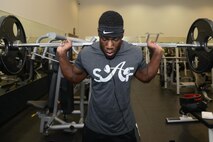 Airman 1st Class Alex Foxx, 87th Flying Training Squadron aviation resource manager, squats weights on Laughlin Air Force Base, Texas, May 3, 2016. Foxx is training for an upcoming competition where he hopes to take home another first place finish. (U.S. Air Force photo/Airman 1st Class Brandon May)