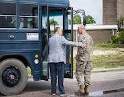Col. David Hanson, 919th Special Operations Wing vice commander, visits with Okaloosa County Commissioner Wayne Harris as they board an Air Force bus during the 919th Special Operations Wing Civic Leader Tour at Duke Field, Fla. April 22.  Each year, the wing invites local civic leaders to spend a day learning more about the wing’s Citizen Air Commandos and their roles in national defense. (U.S. Air Force photo/Tech. Sgt. Jasmin Taylor)