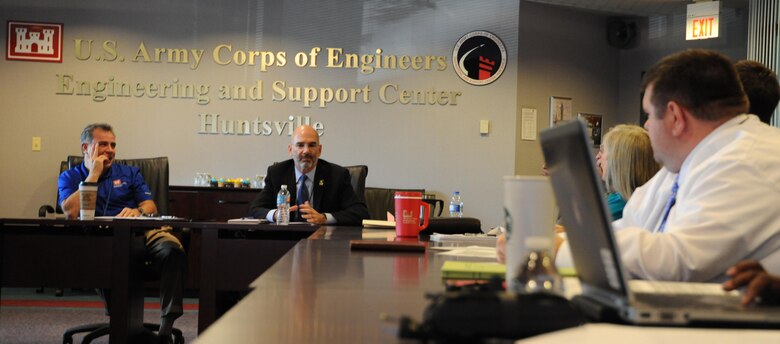 Paul Robinson, left, Huntsville Center Energy Division chief, and Mike McGhee, Army Office of Energy Initiatives executive director, engage with theHuntsville Center Energy Division team during a program overview at the Center May 6. 