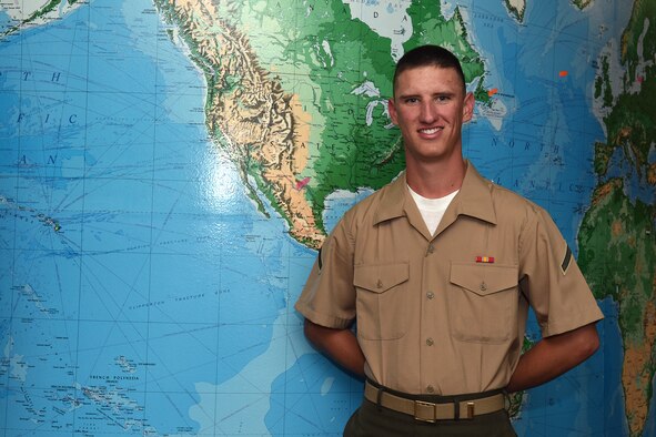 U.S. Marine Corps Pfc. Hunter LoRusso, 312th Training Squadron student, stands next to a world map in Brandenburg Hall on Goodfellow Air Force Base, Texas, May 6, 2016. LoRusso is the Goodfellow Student of the Month Spotlight for April, a series highlighting Team Goodfellow students. (U.S. Air Force photo by Staff Sgt. Laura R. McFarlane/Released)