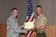 U.S. Air Force Col. Michael Grunwald Jr., 17th Training Group Commander, presents the 312th Training Squadron Student of the Month award for April 2016 to U.S. Marine Corps Pfc. Hunter LoRusso in Brandenburg Hall on Goodfellow Air Force Base, Texas, May 6, 2016. (U.S. Air Force photo by Staff Sgt. Laura R. McFarlane/Released)