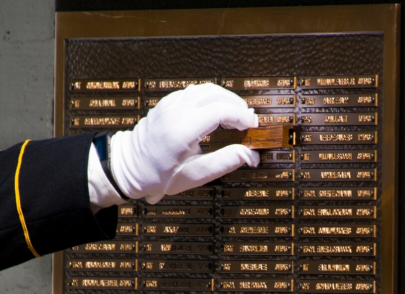 Another Soldier’s name is unveiled at the 47th annual Explosive Ordnance Disposal Memorial Service at the Kauffman EOD Training Complex on Eglin Air Force Base, Fla., May 7, 2016. Names of recent and past fallen EOD technicians are added to the memorial wall during the ceremony each year. The Army, Marines and Navy added six new names this year. The total now stands at 320. (U.S. Air Force photo/Samuel King Jr.)