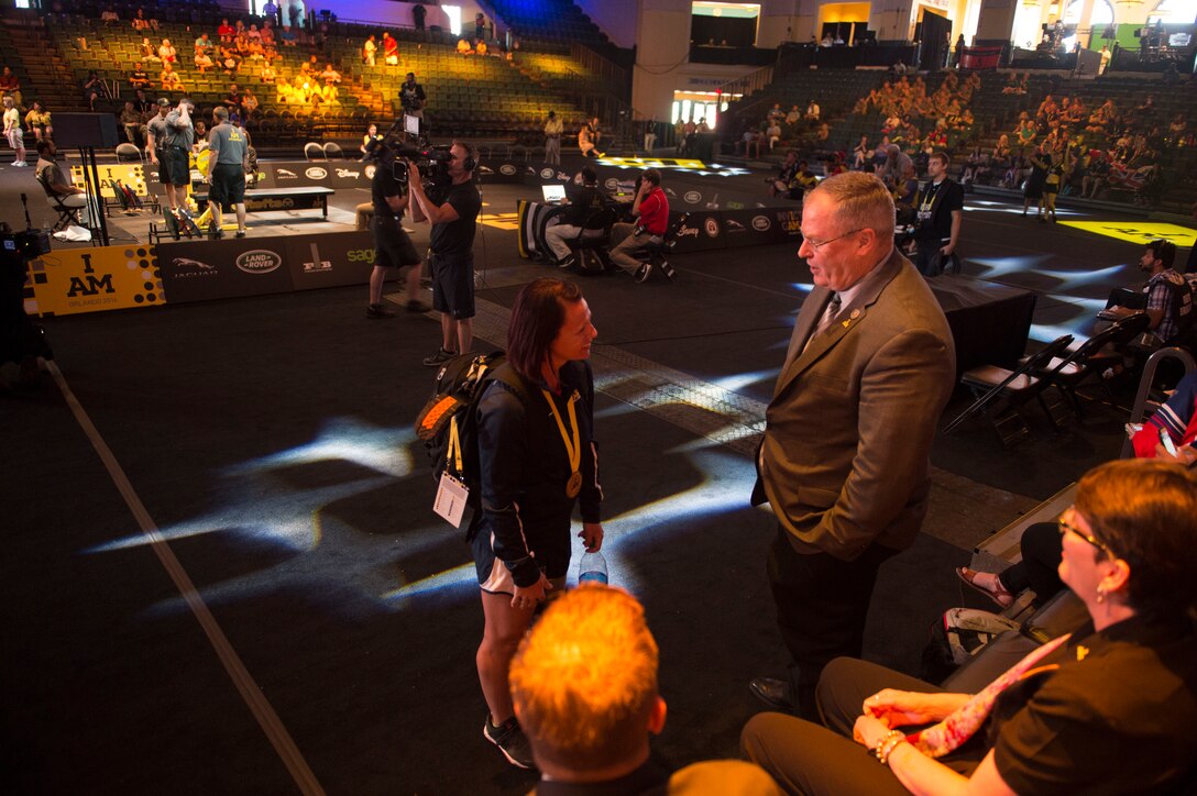 Deputy Defense Secretary Bob Work speaks with a member of Team USA at the 2016 Invictus Games powerlifting finals in Orlando, Fla., May 9, 2016. DoD photo by Navy Petty Officer 1st Class Tim D. Godbee