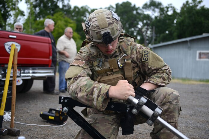 Airman 1st Class Alex Nona, 60th Civil Engineer Squadron explosive ordnance disposal technician, inspects equipment prior to entering an abandoned building known as the “bomb factory” during an exercise May 5th, 2016, at Clear Lake, California. Nona and other EOD technicians were tasked to eliminate numerous improvised explosive devices and a radioactive dispersal device within the abandoned structure. (U.S. Air Force photo by Senior Airman Bobby Cummings)