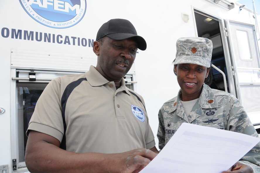 Senior Master Sgt. Kelvin Battle, 94th Emergency Management specialist, and Maj. Andrea Walthour, 94th Communications Squadron commander, review information during the 2016 Statewide Mobile Communication Vehicle Functional Field Exercise, held at Stone Mountain, Ga., May 3-6. The exercise was designed to test on-the-scene communication capability between the federal, state, and local emergency response organizations that participated. (U.S. Air Force photo/ Staff Sgt. Alan Abernethy)