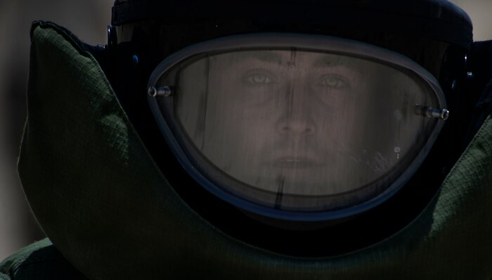 Staff Sgt. Jeffery Glover, 99th Civil Engineer Squadron explosive ordinance technician, walks back to his team after securing a line that will open a car door during a training exercise at Nellis Air Force Base, Nev., May 5, 2016. EOD techs detect, identify, recover, disarm and dispose of unsafe explosives and ordnance. (U.S. Air Force photo by Airman 1st Class Kevin Tanenbaum)
