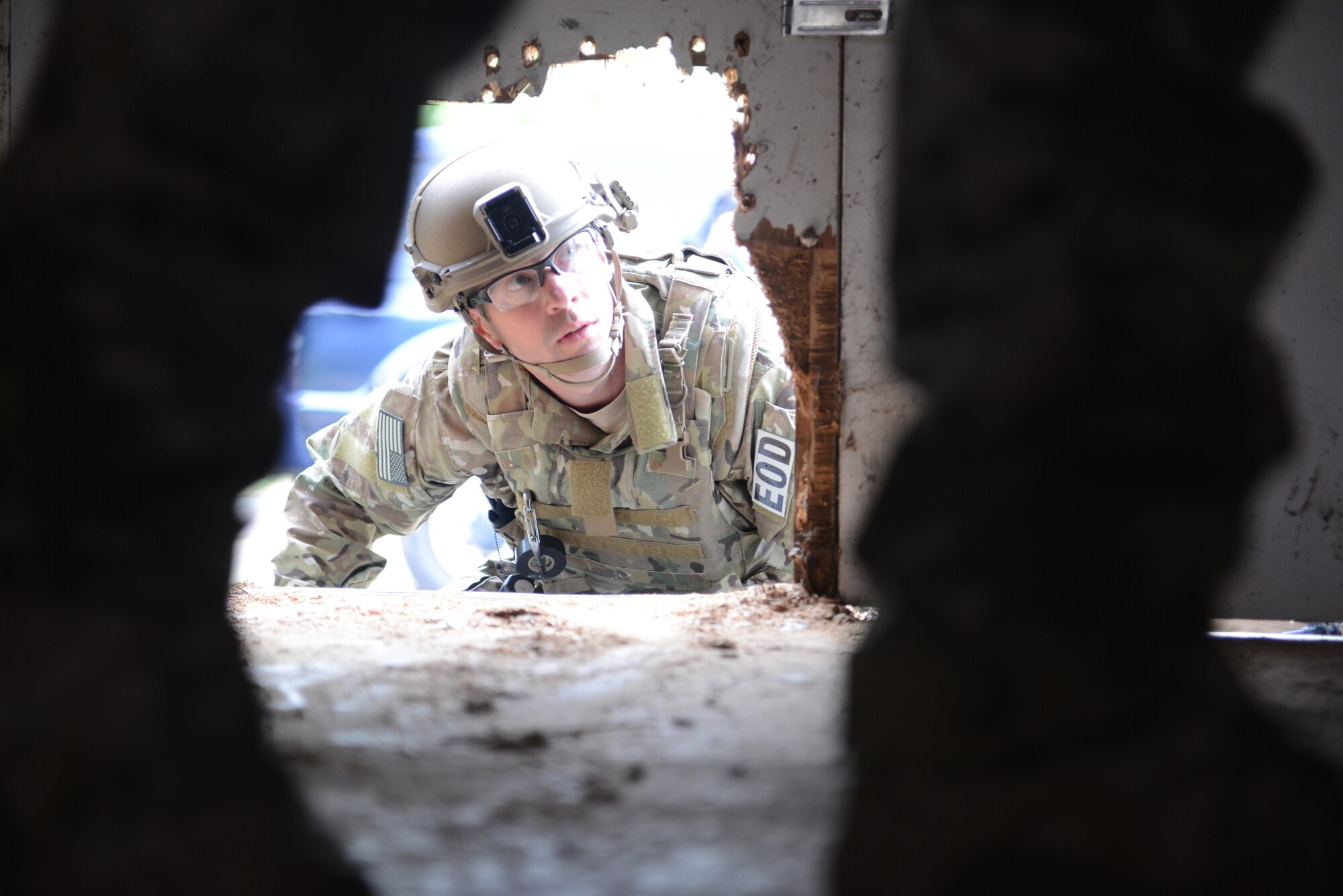 Tech. Sgt. Noah Cheney, 9th Civil Engineer Squadron explosive ordnance disposal technician, prepares to enter an abandoned structure known as the “bomb factory” during an exercise May 5th, 2016, at Clear Lake, California. Cheney and other EOD technicians were tasked to eliminate numerous improvised explosive devices and a radioactive dispersal device within the abandoned structure. (U.S. Air Force photo by Senior Airman Bobby Cummings)