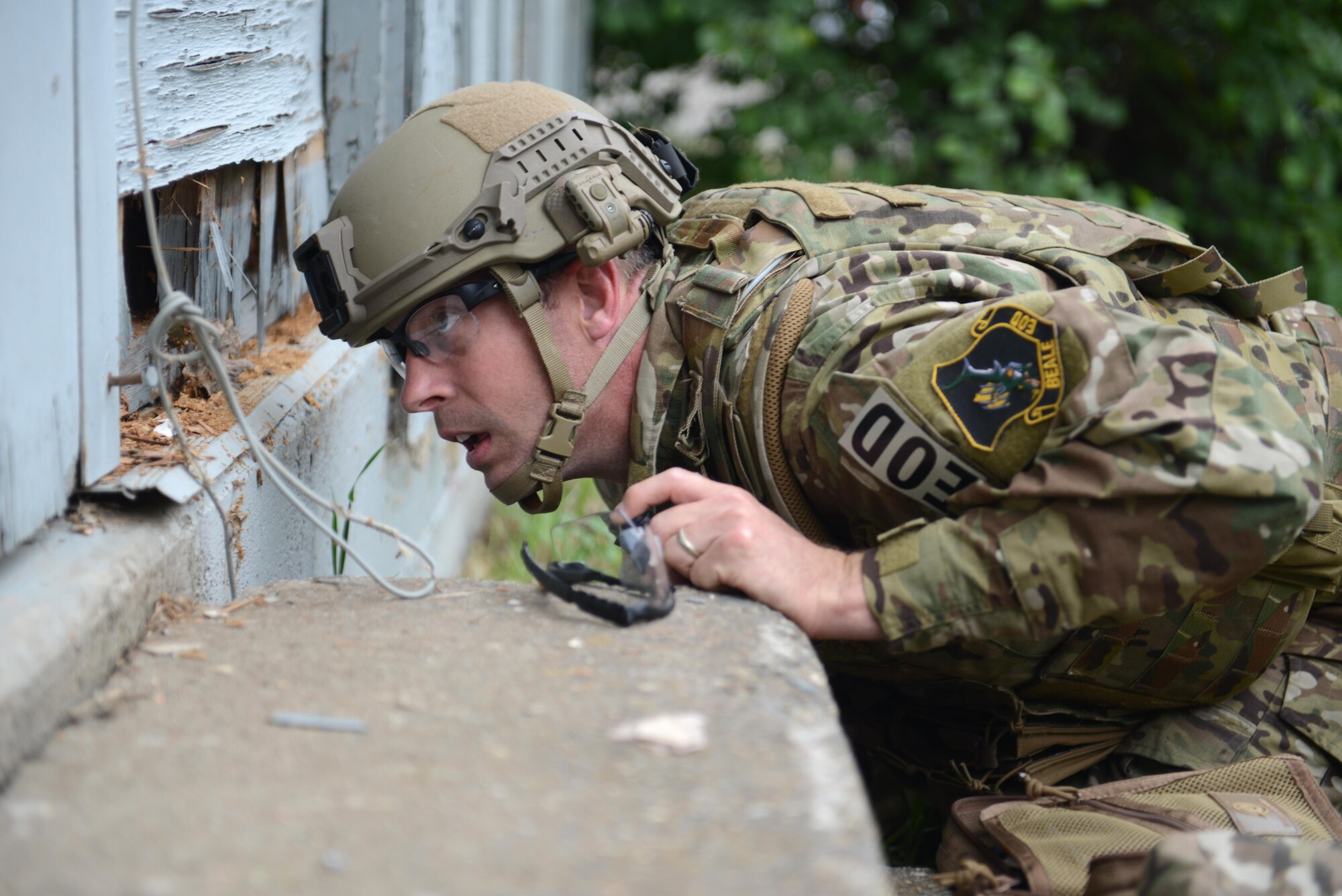 Tech. Sgt. Noah Cheney, 9th Civil Engineer Squadron explosive ordnance disposal technician, evaluates potential entry access points to an abandoned structure known as the “bomb factory” during Operation: Half-Life, an exercise designed to evaluate a synchronized, multi-agency response to a crisis situation May 5th, 2016, at Clear Lake, California. The structure Cheney needed access to contained various improvised explosive devices. (U.S. Air Force photo by Senior Airman Bobby Cummings)