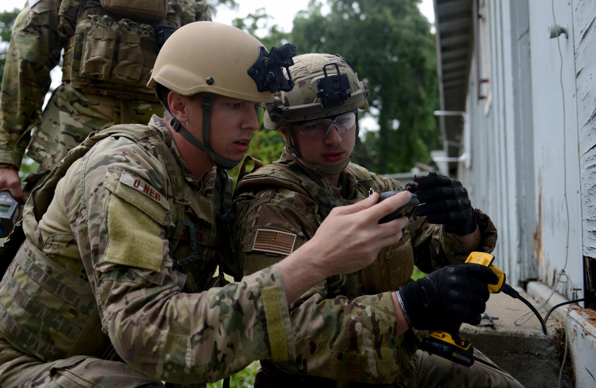 Staff Sgt. David Dezwaan (left), and Airman 1st Class Alex Nona, 60th Civil Engineer Squadron explosive ordnance disposal technicians, conduct radioactive detection methods during an exercise May 5th, 2016, at Clear Lake, California. The EOD technicians were participating in Operation: Half-Life, an exercise designed to evaluate a synchronized, multi-agency response to a crisis situation. (U.S. Air Force photo by Senior Airman Bobby Cummings)