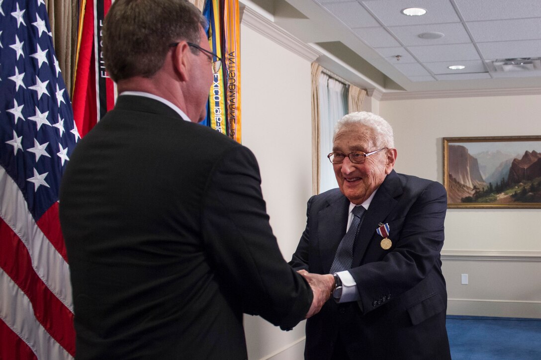 Defense Secretary Ash Carter shakes hands with former Secretary of State Henry A. Kissinger after presenting Kissinger with the Department of Defense Distinguished Public Service Award at the Pentagon, May 9, 2016. DoD photo by Air Force Senior Master Sgt. Adrian Cadiz