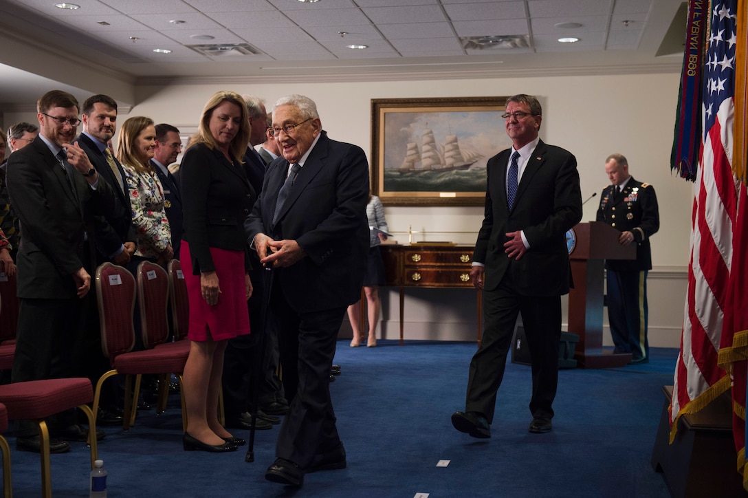 Attendees stand as Defense Secretary Ash Carter, center right, hosts a ceremony to present the Department of Defense Distinguished Public Service Award to former Secretary of State Henry A. Kissinger, center left, at the Pentagon, May 9, 2016. DoD photo by Air Force Senior Master Sgt. Adrian Cadiz