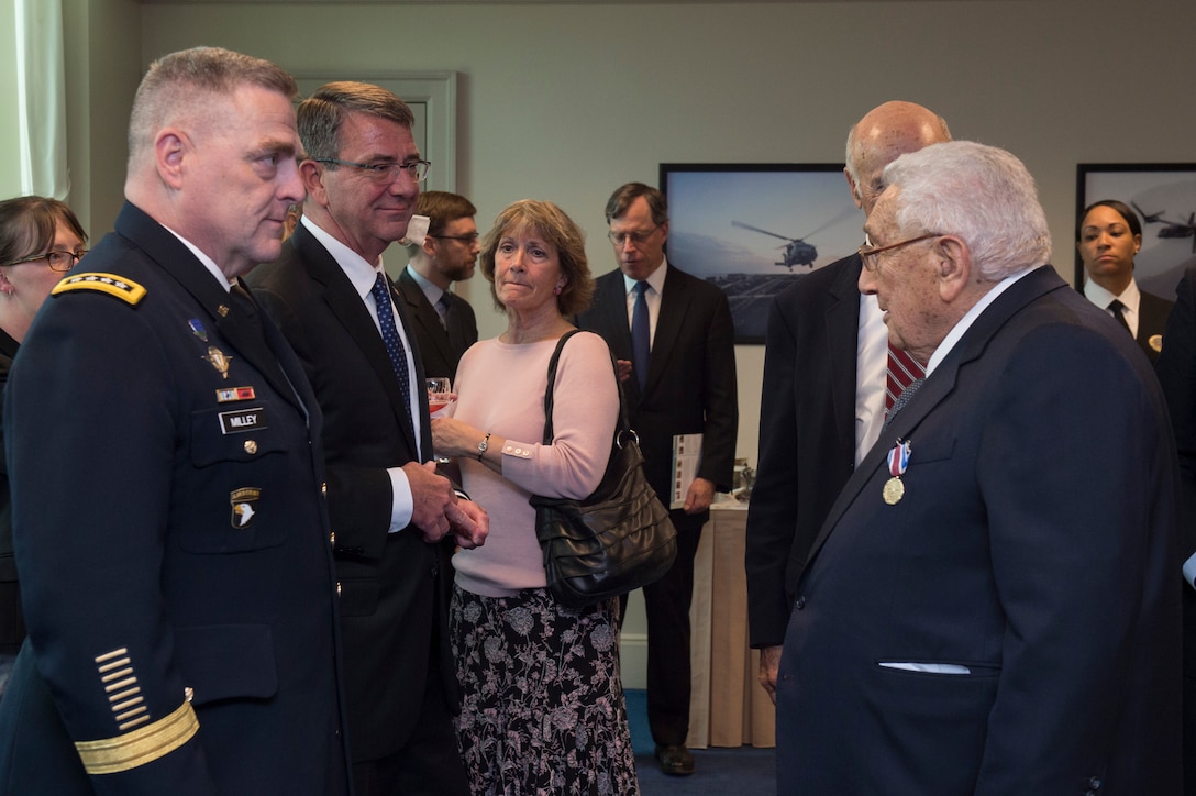 Defense Secretary Ash Carter, center left, speaks with former Secretary of State Henry A. Kissinger, right, after presenting him with the Department of Defense Distinguished Public Service Award at the Pentagon, May 9, 2016. DoD photo by Air Force Senior Master Sgt. Adrian Cadiz