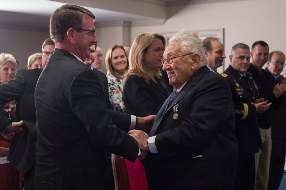 Defense Secretary Ash Carter shakes hands with former Secretary of State Henry A. Kissinger after presenting Kissinger with the Department of Defense Distinguished Public Service Award during a ceremony at the Pentagon, May 9, 2016. DoD photo by Air Force Senior Master Sgt. Adrian Cadiz