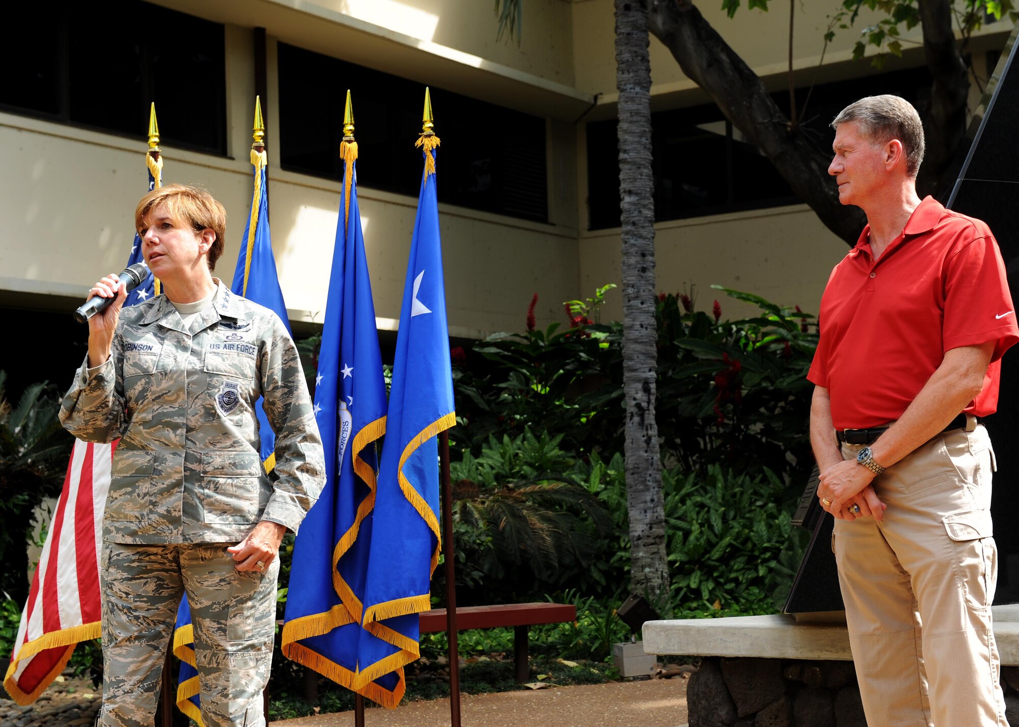 U.S. Air Force Gen. Lori J. Robinson, Pacific Air Forces commander and the U.S. Pacific Command Joint Force Air Component commander, accompanied by her husband, retired U.S. Air Force Maj. Gen. David Robinson, addresses Airmen from the headquarters staff at Joint Base Pearl Harbor-Hickam, Hawaii, May 3, 2016. Robinson will depart PACAF May 10 to assume her new role as the North American Aerospace Defense and U.S. Northern Command commander, following her confirmation by the Senate. In accordance with Air Force regulations on appointment to and assumption of command, U.S. Air Force Lt. Gen. Russell J. Handy, the 11th Air Force commander, will serve as the PACAF and PACOM JFACC until a new one is confirmed by the Senate and assumes command. Handy will also continue to serve as the 11th AF commander. (U.S. Air Force photo by Staff Sgt. Alex Martinez/Released)