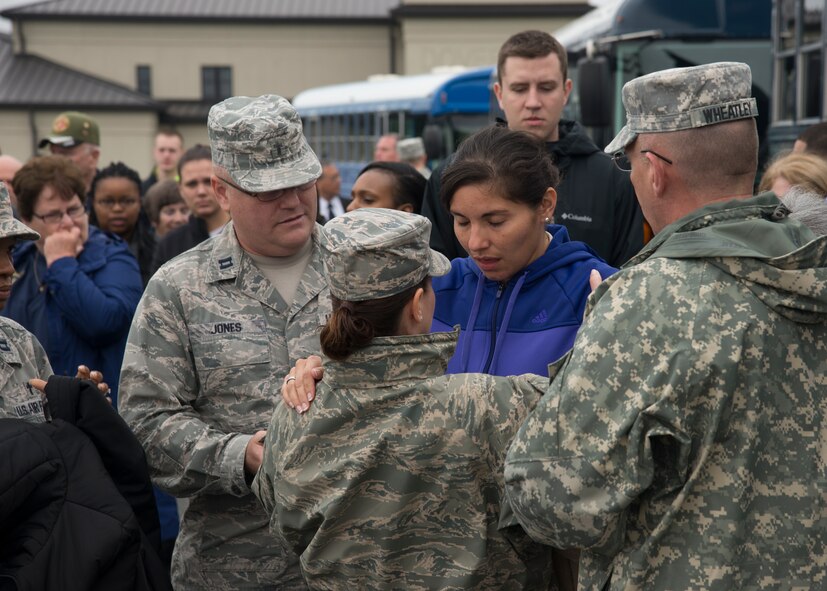 U.S. Military chaplains console role player at the Folded Flag 2016 mass fatality dignified transfer exercise May 4, 2016, at Dover Air Force Base, Del. The role player simulated a grieving family member of a fallen service member. (U.S. Air Force photo/Senior Airman Zachary Cacicia)